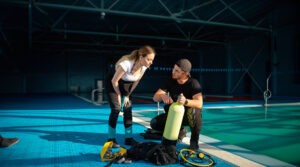 scuba diving certification courses for beginners - new diver learning the gear - scubly