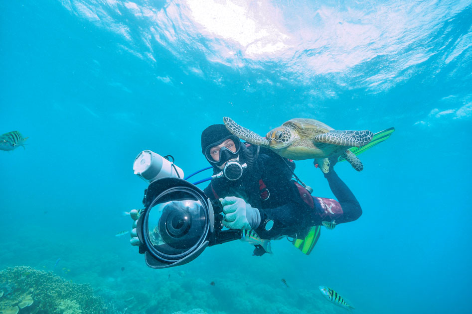 scuba gear accessories - diver with camera - scubly